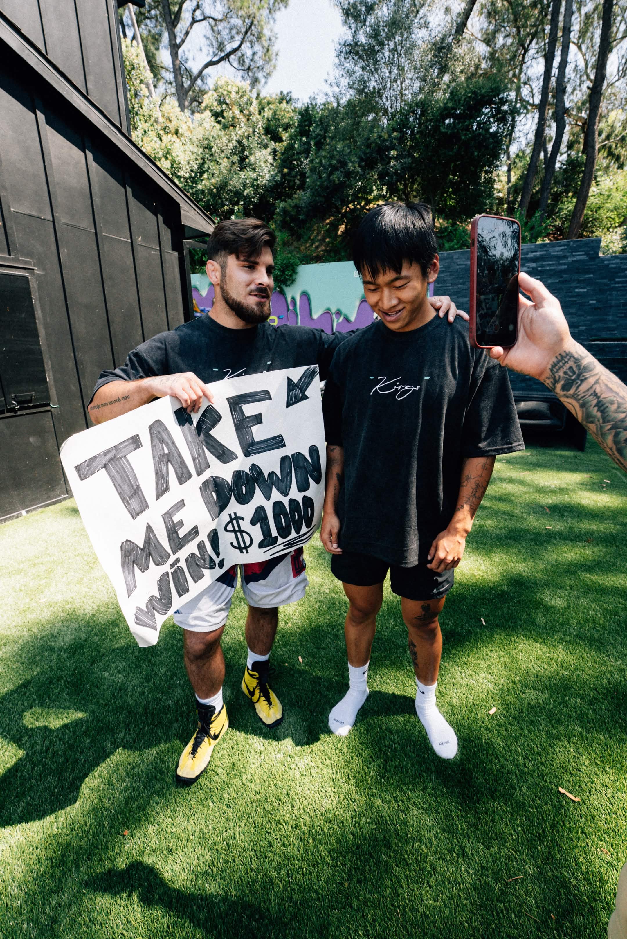 Georgio Poullas filming the Instagram takedown bounty campaign