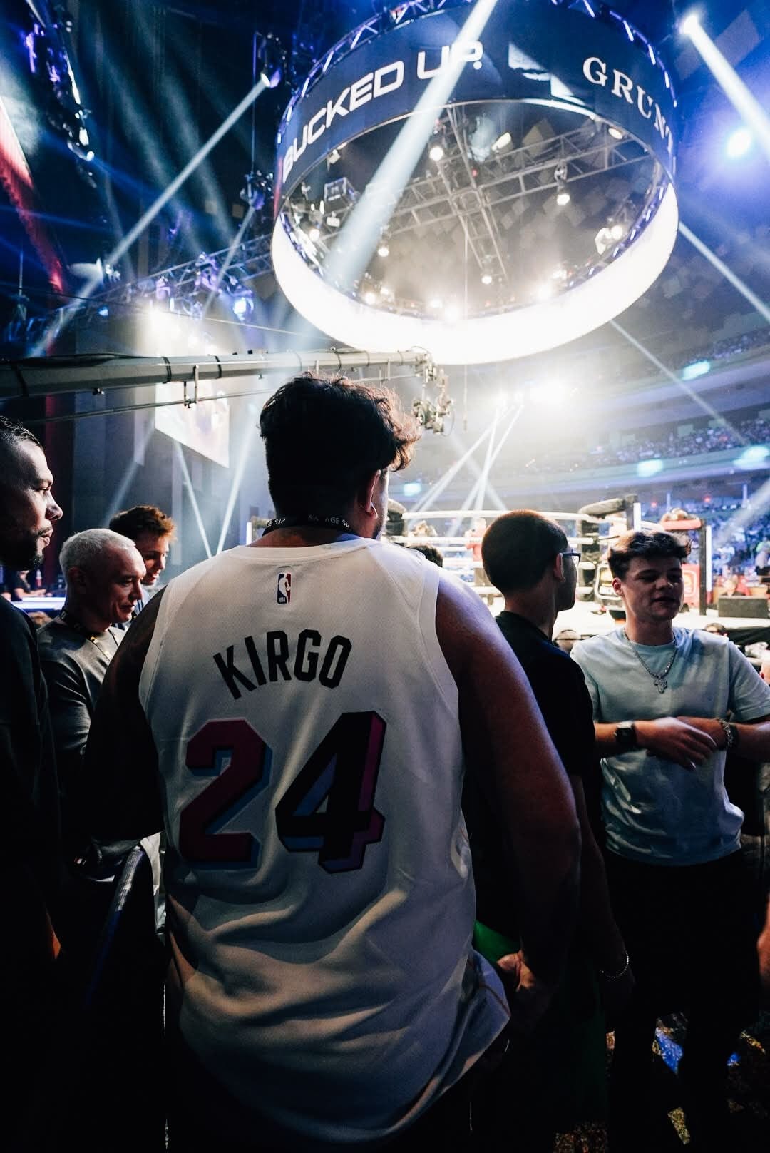 Fan in a Kirgo basketball jersey ringside at the BKFC event